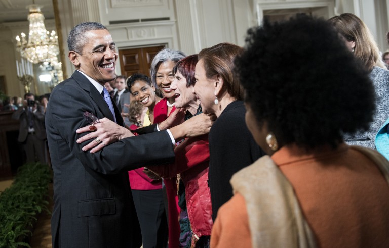 President Barack Obama is hugged by Rep. Rosa L. DeLauro ,D-CT, following an equal pay event in the White House in 2014. Obama designated the Sewall-Belmont House, which played a role in the U.S. women's suffrage movement, as a national monument Tuesday. Photo by Brendan Smialowski/AFP/Getty Images