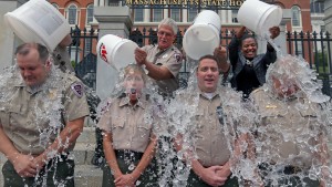 Lt. Sean Flood, Ranger Deb McNamara, Ranger Ted Fusco and Capt. Stephen Owens, who help provide security at the Massachusetts State House, participate in the ALS Ice Bucket Challenge on Aug. 7. Photo by David L. Ryan/The Boston Globe via Getty Images