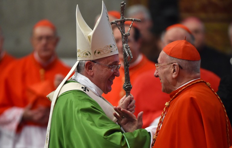 Pope Francis (L) greets French cardinal Roger Etchegaray at the end of the mass at St Peter's basilica on October 5, 2014 at the Vatican. AFP PHOTO / GABRIEL BOUYS (Photo credit should read GABRIEL BOUYS/AFP/Getty Images)