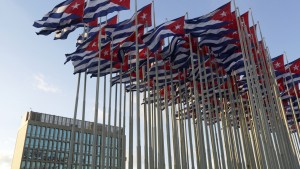 Cuban flags fly beside the United States Interests Section in Havana (USINT), in Havana