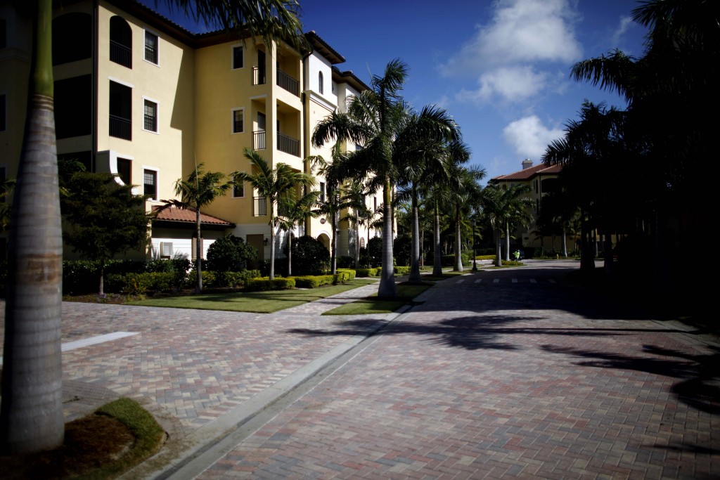 The Naples-Immokalee-Marco Island area of Florida is one of the fastest growing in the country. Palm trees line a street in WCI Communities Inc.'s Marquesa Royale neighborhood at Tiburon in Naples, Florida, U.S., on Thursday, Feb. 24, 2011. Sales in the Naples area last year rose 10 percent, the first annual increase in at least five years, while the median price for homes listed at $300,000 or more gained 4 percent to $544,000, according to data compiled by the Naples Area Board of Realtors. Photographer: Michel Fortier/Bloomberg via Getty Images
