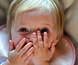 A new study suggests that babies are more likely to learn when an object acts in a way that surprises them. That may be why games like peekaboo hold an infant's attention. Photo courtesy of Brian Warren/Flickr.