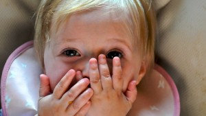 A new study suggests that babies are more likely to learn when an object acts in a way that surprises them. That may be why games like peekaboo hold an infant's attention. Photo courtesy of Brian Warren/Flickr.