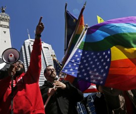 Organizers fire up a crowd of demonstrators gathered to protest a controversial religious freedom bill recently signed by Governor Mike Pence, in Indianapolis March 28, 2015. An Indiana pizza shop that that closed down after comments made by its owners place it at the center of a national controversy raised over $800,000 on the crowdfunding site GoFundMe this week. Photo by Nate Chute/Reuters