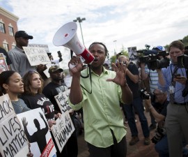 Muhiydin Moye D'Baha of the Black Lives Matter movement leads the protest at a rally in North Charleston