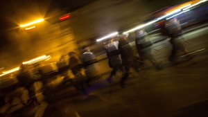 Police officers march at North Ave and Pennsylvania Ave in Baltimore, Maryland