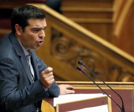 Greek Prime Minister Alexis Tsipras delivers his speech as he attends a parliamentary session in Athens, Greece, July 10, 2015. Tsipras appealed to his party's lawmakers on Friday to back a tough reforms package after abruptly offering last-minute concessions to try to save the country from financial meltdown. REUTERS/Christian Hartmann - RTX1JXVY