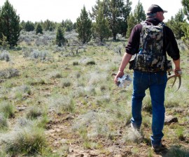 Troy Capps carries deer antlers he found in Central Oregon. Photo by Courtney Flatt/NWPR/EarthFix
