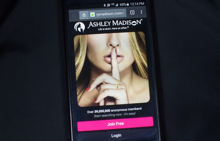 A photo illustration shows the Ashley Madison website displayed on a smartphone in Toronto, August 20, 2015. Love lives and reputations may be at risk after the release of customer data from infidelity website Ashley Madison, an unprecedented breach of privacy likely to rattle users' attitudes towards the Internet. Hackers dumped a big cache of data containing millions of email addresses for U.S. government officials, UK civil servants and high-level executives at European and North America corporations late on Tuesday, the latest cyber attack to raise concerns about Internet security and data protection.   REUTERS/Mark Blinch  - RTX1OZ5D