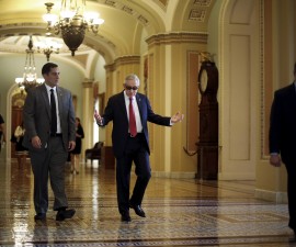 U.S. Senate Minority Leader Harry Reid (D-NV) (C) walks to his office as he arrives at the U.S. Capitol in Washington September 8, 2015. Reid, the Democratic leader in the U.S. Senate, issued a ringing defense of the Iran nuclear deal on Tuesday, saying the agreement would survive the high stakes review by Congress.  REUTERS/Jonathan Ernst - RTX1RNSH