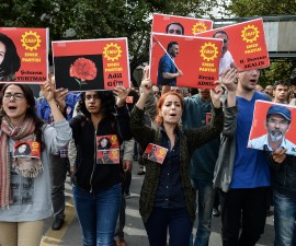ANKARA, TURKEY - OCTOBER 11: Members of the left-wing Labour Party (EMEP) carry pictures of the victims of Saturday's bomb blasts during a commemoration on October 11, 2015 in Ankara, Turkey. Scuffles broke out as police prevented pro-Kurdish politicians and other mourners from laying carnations at the site of two suspected suicide bombings that killed 95 people and wounded hundreds in Turkey's deadliest attack in years. Police insisted investigators were still working at the site. Turkish PM Davutoglu declares three days of national mourning over Ankara bomb attacks. (Photo by Gokhan Tan/Getty Images)