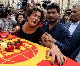 ANKARA, TURKEY - OCTOBER 11: Family members of Korkmaz Tedik, a victim of Saturday's bomb blasts, mourn over his coffin during a funeral ceremony in Ankara, October 11, 2015 Turkey. Thousands of people, many chanting anti-government slogans, gathered in central Ankara on Sunday near the scene of bomb blasts which killed at least 95 people, mourning the victims of the most deadly attack of its kind on Turkish soil. Police insisted investigators were still working at the site. Turkish PM Davutoglu declares three days of national mourning over Ankara bomb attacks. (Photo by Gokhan Tan/Getty Images)