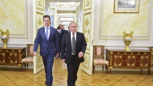 Russian President Vladimir Putin (R) and Syrian President Bashar al-Assad enter a hall during a meeting at the Kremlin in Moscow, Russia, October 20, 2015. Assad made a surprise visit to Moscow on Tuesday evening to thank Putin for launching air strikes against Islamist militants in Syria. Picture taken October 20, 2015. REUTERS/Alexei Druzhinin/RIA Novosti/Kremlin ATTENTION EDITORS - THIS IMAGE HAS BEEN SUPPLIED BY A THIRD PARTY. IT IS DISTRIBUTED, EXACTLY AS RECEIVED BY REUTERS, AS A SERVICE TO CLIENTS.   - RTS5E2Z