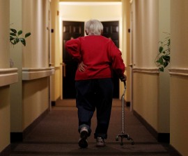 Inez Willis, a senior citizen, walks down the hallway with the aide of a cane to visit a neighbor at her independent living complex in Silver Spring, Maryland April 11, 2012. REUTERS/Gary Cameron   (UNITED STATES - Tags: SOCIETY HEALTH) - RTR30N4P Related words: Medicare , meds, drugs, pills