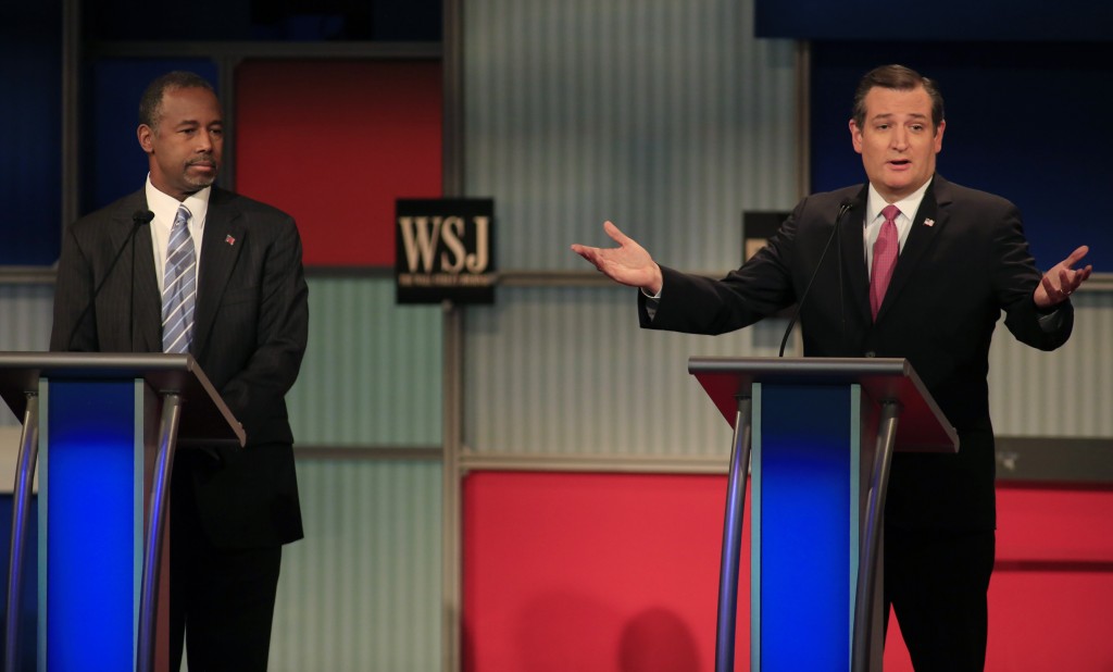 Republican U.S. presidential candidate Dr. Ben Carson listens as U.S. Senator Ted Cruz speaks at the debate held by Fox Business Network in Milwaukee, Wisconsin. Photo by Darren Hauck/Reuters