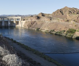 Parker Dam is shown in this photo taken April 16, 2015. The dam impounds Colorado River water into Lake Havasu (rear), where it is pumped into the Colorado Aqueduct for delivery to Southern California. The dam was built between 1934 -1938 and is operated by the Metropolitan Water District of Southern California. Photo taken April 16, 2015. REUTERS/Sam Mircovich - RTX19QVV