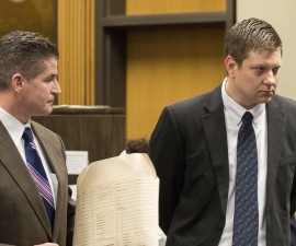 Chicago police officer Jason Van Dyke (R), leaves the courtroom after a hearing with his attorney Daniel Herbert at Leighton Criminal Court Building in Chicago, Illinois in this December 18, 2015, pool photo. Van Dyke, the Chicago police officer who shot a black teenager last year, is expected to plead not guilty to murder charges on December 29, 2015, as Mayor Rahm Emanuel cut short a vacation after two more fatal police shootings over the weekend. REUTERS/Zbigniew Bzdak/Pool - RTX20EVK