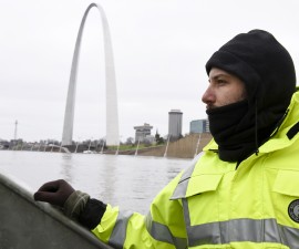 U.S. Geological Survey (USGS) hydro technician Jason Carron assesses the Mississippi River flood waters in St. Louis, Missouri December 31, 2015.  Missouri and Illinois were bracing for more flooding on Thursday as rain-swollen rivers, some at record heights, overflowed their banks, washing out hundreds of structures and leaving thousands of people displaced from their homes.  REUTERS/Kate Munsch - RTX20O4V