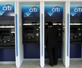 A man uses a Citibank automated teller machine at a branch in Washington January 19, 2010. Citigroup Inc posted a $7.6 billion quarterly loss on costs related to repayment of U.S. bailout funds and still-high loan losses, but the bank's shares edged higher as some investors saw glimmers of hope. REUTERS/Jim Young (UNITED STATES - Tags: BUSINESS) - RTR292W2