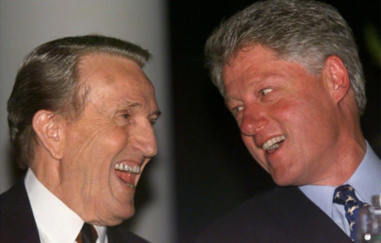 President Clinton and former Sen. Dale Bumpers laugh as they watch a video about the life of Bumpers in Little Rock, late March 13. The event was a tribute to the retiring Arkansas senator who served in the U.S. Senate for 24 years and a "thank you" from Clinton for Bumpers' support during the impeachment process. Photo by Reuters.