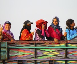 Syrians who fled recent fighting in Aleppo ride on a truck in the south of Aleppo Province, Syria, October 19, 2015. REUTERS/Ammar Abdullah - RTS7PI2