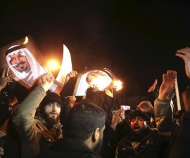 People protest in front of Saudi Arabia's embassy during a demonstration in Tehran January 2, 2016. Iranian protesters stormed the Saudi Embassy in Tehran early on Sunday morning as Shi'ite Muslim Iran reacted with fury to Saudi Arabia's execution of a prominent Shi'ite cleric. REUTERS/TIMA/Mehdi Ghasemi/ISNA ATTENTION EDITORS - THIS PICTURE WAS PROVIDED BY A THIRD PARTY. REUTERS IS UNABLE TO INDEPENDENTLY VERIFY THE AUTHENTICITY, CONTENT, LOCATION OR DATE OF THIS IMAGE. FOR EDITORIAL USE ONLY. NOT FOR SALE FOR MARKETING OR ADVERTISING CAMPAIGNS. NO THIRD PARTY SALES. NOT FOR USE BY REUTERS THIRD PARTY DISTRIBUTORS. THIS PICTURE IS DISTRIBUTED EXACTLY AS RECEIVED BY REUTERS, AS A SERVICE TO CLIENTS - RTX20U1H