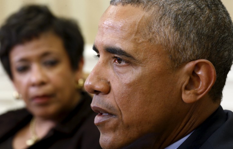 U.S. Attorney General Loretta Lynch (L) looks toward U.S. President Barack Obama during a meeting with top law enforcement officials to discuss what executive actions he can take to curb gun violence, in the Oval Office of the White House in Washington, D.C., on Jan. 4, 2016. Photo by Kevin Lamarque/Reuters