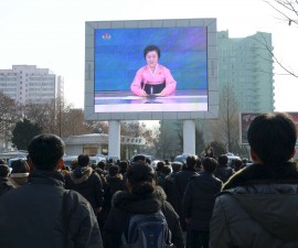 People watch a huge screen broadcasting the government's announcement in Pyongyang, North Korea, in this photo released by Kyodo January 6, 2016. North Korea said it successfully tested a miniaturised hydrogen nuclear bomb on Wednesday, claiming a significant advance in its strike capability and setting off alarm bells in Japan and South Korea. Mandatory credit REUTERS/Kyodo ATTENTION EDITORS - THIS IMAGE HAS BEEN SUPPLIED BY A THIRD PARTY. FOR EDITORIAL USE ONLY. NOT FOR SALE FOR MARKETING OR ADVERTISING CAMPAIGNS. MANDATORY CREDIT. JAPAN OUT. NO COMMERCIAL OR EDITORIAL SALES IN JAPAN. THIS PICTURE IS DISTRIBUTED EXACTLY AS RECEIVED BY REUTERS, AS A SERVICE TO CLIENTS. - RTX21999