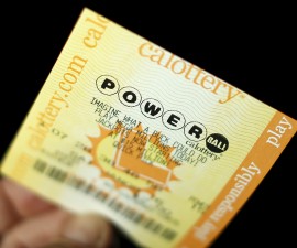 A Powerball lottery ticket is shown in this illustration photograph in Encinitas, California January 8, 2016. The jackpot in the Powerball lottery, already the largest ever payout in North American history, continued to climb, hitting an estimated $800 million on Friday, the operator of the multistate game said. Photo by Mike Blake/Reuters