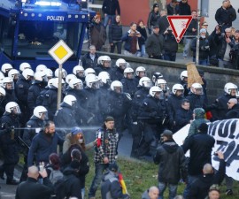 Police use pepper spray against supporters of anti-immigration right-wing movement PEGIDA (Patriotic Europeans Against the Islamisation of the West) during a demonstration march, in reaction to mass assaults on women on New Year's Eve, in Cologne, Germany, January 9, 2016.     REUTERS/Wolfgang Rattay  - RTX21NF6