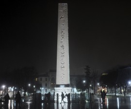People walk at the explosion site in Sultanahmet square in Istanbul, Turkey, late January 12, 2016. A suicide bomber thought to have crossed recently from Syria killed at least 10 people, most of them German tourists, at Sultanahmet square in Istanbul's historic heart on Tuesday, in an attack Prime Minister Ahmet Davutoglu blamed on Islamic State. REUTERS/Yagiz Karahan  - RTX224BW
