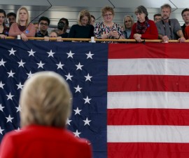 Audience members listen as U.S. Democratic presidential candidate Hillary Clinton speaks during a "Get Out to Caucus" rally at Iowa State University in Ames, Iowa January 30, 2016. REUTERS/Brian Snyder - RTX24Q39