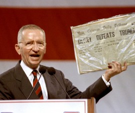 Independent Presidential candidate Ross Perot holds aloft historic newspaper Nov 1 that declared Thomas Dewey the victor in the presidential race against Harry Truman. Perot drew a parallel to his own candidacy in front of 12,000 people. - RTXF2YE
