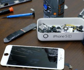 Pieces of an iPhone are seen in a repair store in New York. A court order demanding that Apple Inc help the U.S. government unlock the encrypted iPhone of one of the San Bernardino shooters opens a new chapter in the legal, political and technological fight pitting law enforcement against civil liberties advocates and major tech companies. Photo by Eduardo Munoz/Reuters