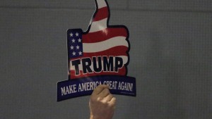 A supporter for U.S. Republican presidential candidate Donald Trump holds up a sign during a campaign event in Hickory, North Carolina March 14, 2016. REUTERS/Chris Keane - RTX294WR