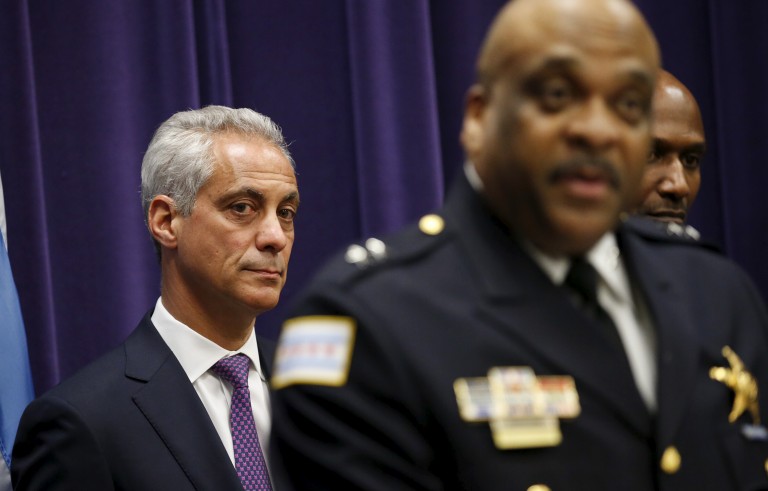 Chicago Mayor Rahm Emanuel (L) listens to Eddie Johnson (R) after introducing him as the Interim Superintendent of the Chicago Police Department, during a news conference in Chicago, March 28, 2016. REUTERS/Kamil Krzaczynski - RTSCKAB