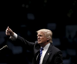 Republican U.S. presidential candidate Donald Trump reacts to the cheers of supporters at a campaign rally in Albany, New York, April 11, 2016.  REUTERS/Mike Segar - RTX29IUJ
