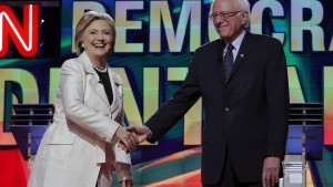 Democratic U.S. presidential candidate and former Secretary of State Hillary Clinton (L) shakes hands with Senator Bernie Sanders at the start of their debate hosted by CNN and New York One at the Brooklyn Navy Yard in New York April 14, 2016.  REUTERS/Brian Snyder - RTX2A195