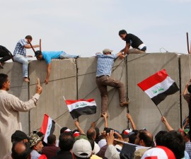 Followers of Iraq's Shi'ite cleric Moqtada al-Sadr storm Baghdad's Green Zone after lawmakers failed to convene for a vote on overhauling the government, in Iraq April 30, 2016. REUTERS/Khalid al Mousily - RTX2C8W2