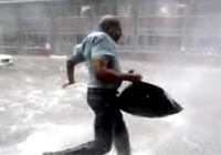 man running across a flooded street