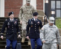 U.S. Army Sergeant Bowe Bergdahl (2nd R) leaves the courthouse with his defense attorney, Lt. Col. Franklin Rosenblatt (L), after an arraignment hearing for his court-martial in Fort Bragg, North Carolina, December 22, 2015. Bergdahl, who spent five years as a Taliban prisoner after walking away from his combat outpost in Afghanistan in 2009, did not enter a plea on Tuesday at his arraignment on charges spurred by his disappearance. REUTERS/Jonathan Drake - RTX1ZSBO