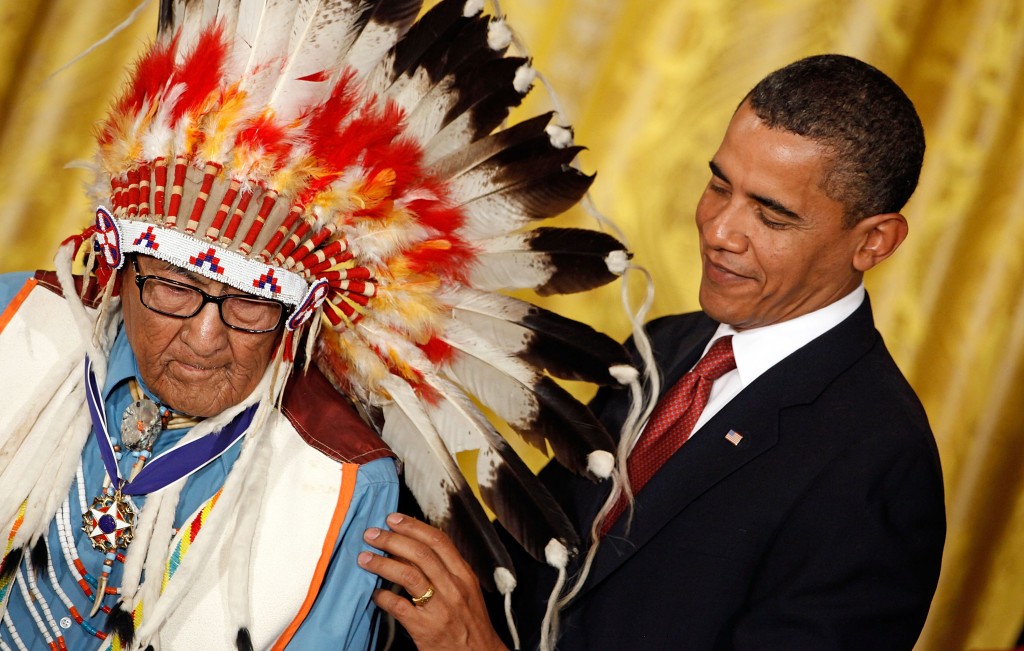 President Barack Obama (R) presents the Medal of Freedom to Crow War Chief Dr. Joseph Medicine Crow, also known as "High Bird" during a ceremony in the White House in August 2009, in Washington, D.C. Photo by Chip Somodevilla/Getty Images