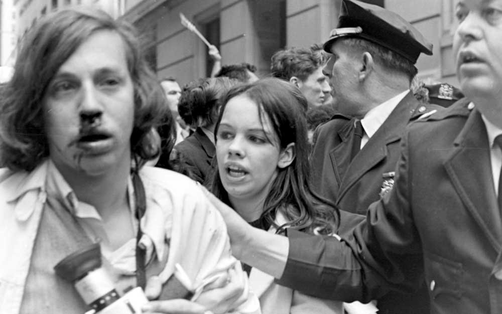Student protester David Friedman is helped up after being attacked on May 8, 1970. Photo by Howard Petrick. David-Friedman.jpg