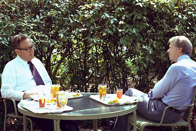 Henry Kissinger and Jimmy Carter during a lunch meeting on the White House patio, August 15.1977. (National Archives) jc_and_hak_1977.jpg