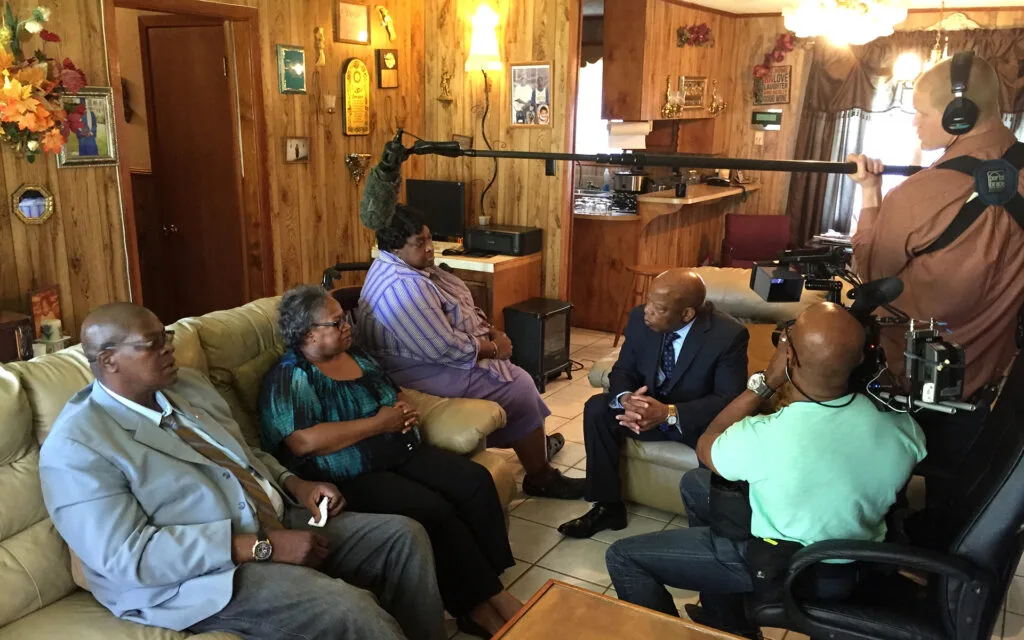 From left, Wharlest Jackson Jr., Denise Jackson Ford and Debra Jackson Sylvester meet with U.S. Rep. John Lewis in 2015 during the filming of "American Reckoning."