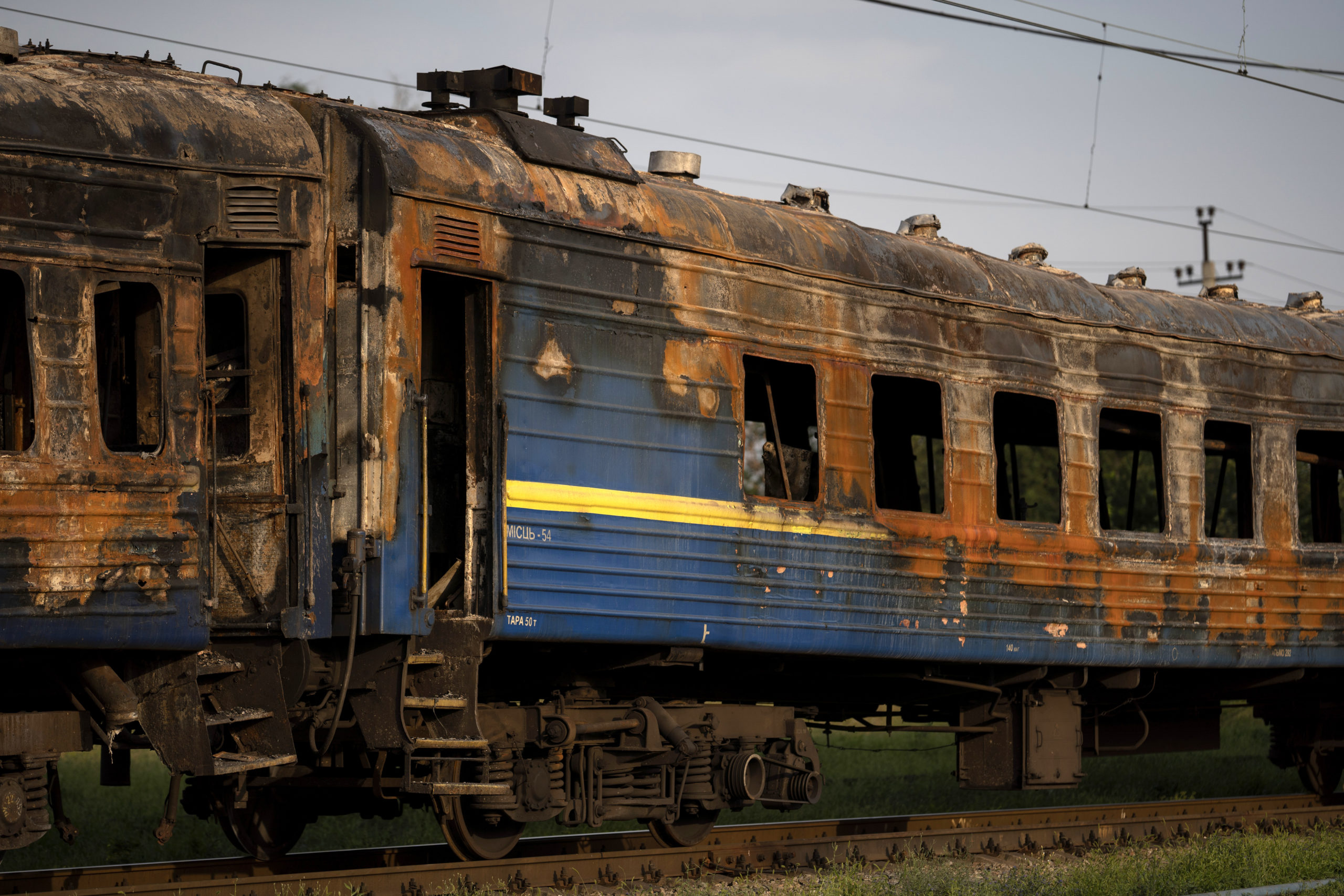 A heavily damaged train sits at a train station in Chaplyne, Ukraine, on Aug. 25, the day after a Russian attack on Ukraine's Independence Day.