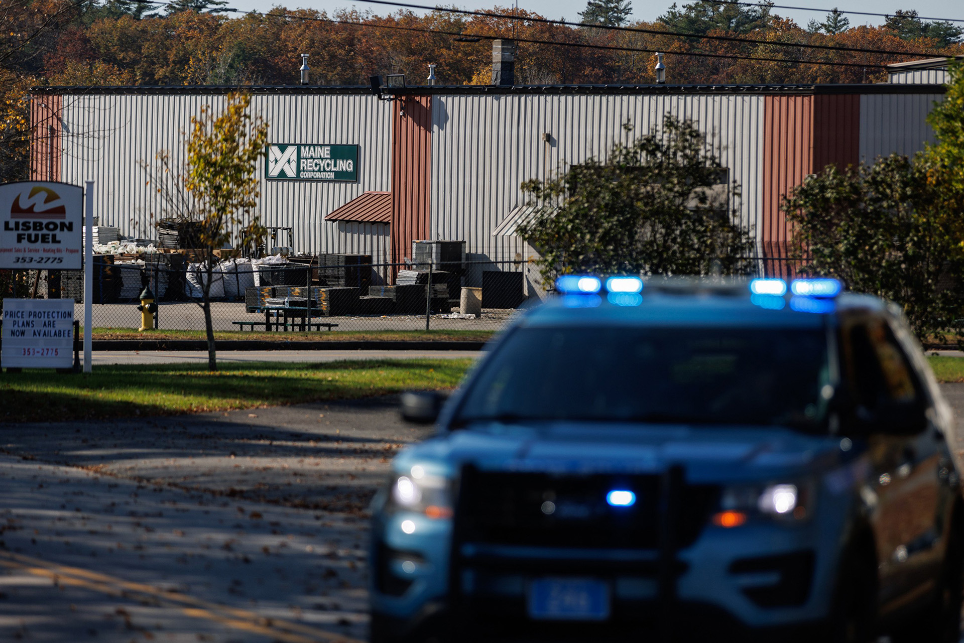 Maine Recycling Corporation seen in the background with a police car in the foreground.