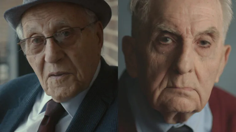 A composite shot of two elderly men looking at the camera. The one on the left wears glasses and a hat, suit and tie, while the one on the right wears a maroon sweater.