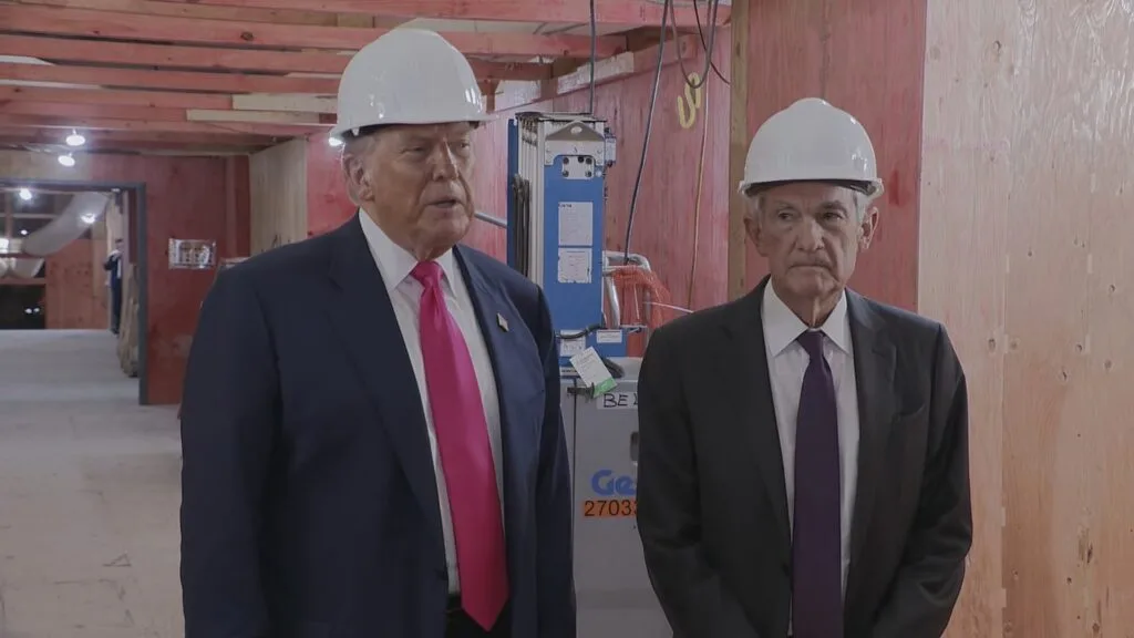 President Donald Trump (L) and Fed Chair Jerome Powell (R) during Trump's July 2025 visit to a Federal Reserve building undergoing renovations.