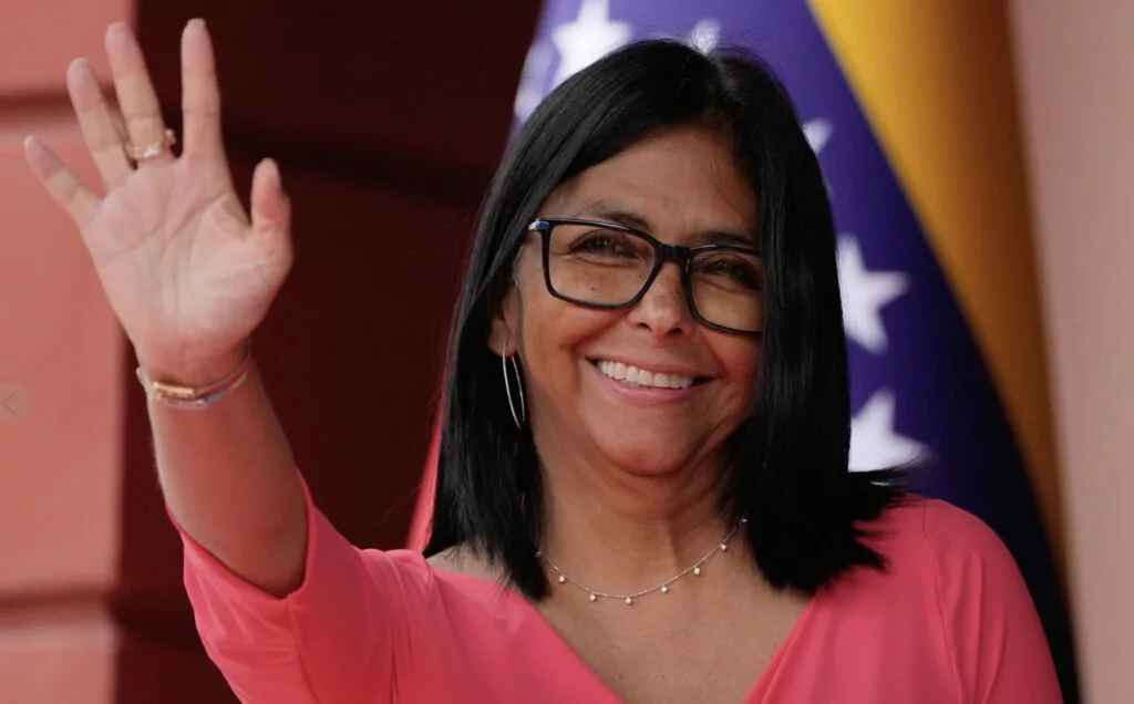 Venezuela’s acting President Delcy Rodríguez waves as she waits for Colombian President Gustavo Petro in Caracas, Venezula, Friday, April 24, 2026.